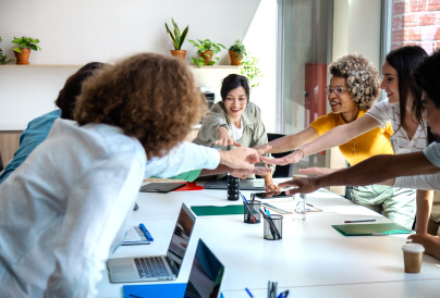 group of multiracial coworkers join hands to celeb 2025 01 07 18 16 59 utc