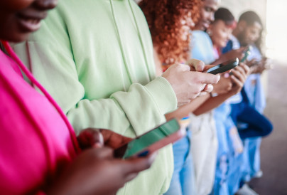 group of people hold mobile phones using social me 2026 01 08 05 28 09 utc