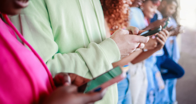 group of people hold mobile phones using social me 2026 01 08 05 28 09 utc